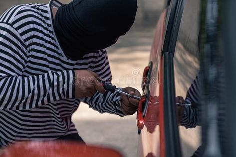 Car thief trying to unlock a car by screwdriver. #Sponsored , #PAID, #Paid, #thief, #car, #unlock, #Car Car Thief, Hip Raises, Evening Sun, A Car, Screwdriver, Photo Image, Seeds, Editorial, Anime Art