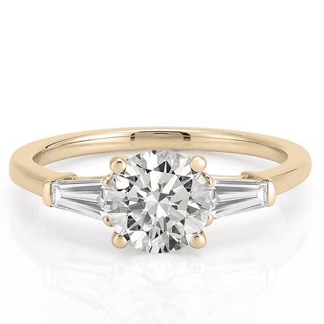 This engagement ring features two diamond tapered baguettes on either side of the center stone, which accentuates any center stone. This tapered baguette engagement ring has a basket setting and allows light to shine through for the perfect amount of sparkle. The tapered baguette engagement ring is designed to pair with our Baguette Eternity Band. Round And Baguette Engagement Ring, Tapered Baguette Engagement Ring, Tapered Baguette Ring, Tapered Engagement Ring, Baguette Eternity Band, Baguette Band, Baguette Engagement Ring, Hall Of Mirrors, Round Engagement Ring