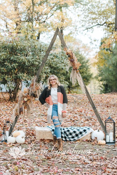 senior photo inspo, fall mini sessions, autumn aesthetic, triangle arch, triangle arch for weddings, triangle arch for photo booth Arch For Photoshoot, Triangle Arch Photoshoot, Fall Triangle Arch, Fall Photoshoot Backgrounds, Fall Family Mini Session Ideas, Triangle Arch Fall Photoshoot, Fall Photoshoot Props Mini Sessions, Fall Photo Backdrop Ideas Outdoor, Fall Photoshoot Background Ideas