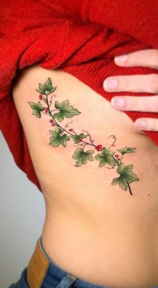 Ivy Rib Tattoo, Ivy With Flowers Tattoo, Ivy Vine Tattoo For Women, Holly Vine Tattoo, Holly And Ivy Tattoo, Vine Side Tattoo, Cherry Vine Tattoo, Ivy Plant Tattoo, Poison Ivy Tattoo Vines