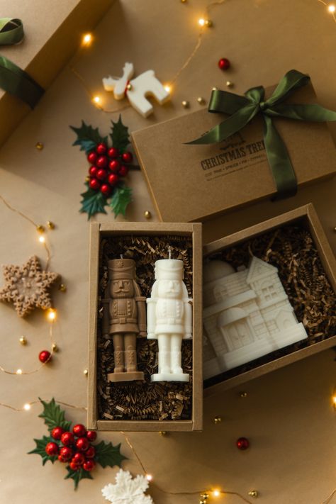 Gift box with 2 Nutcrackers of your choice Variation: 2 Nutcracker ivory color 1 ivory, 1 caramel color 2 caramel color ----------------------------  Gift Box is the perfect gift for yourself, friends or family.  Dimensions: ---------------- H: 5,31 inch  W: 2 inch Dimensions of Box 8 inch x 4,1 inch x 2,3 inch Boxes come wrapped in olive-green satin ribbon Shipping:  ------------- Every candle carefully wrapped and secure placed into shipping box surrounded additional protection layer. Candles are made to order so please allow up to 3-5 business days for dispatch (excluding shipping times).                   About candle: ------------------- Our candles are made with all-natural premium-quality Soy Wax and cotton wicks. They are non-toxic and eco-friendly alternatives to Paraffin wax. Can Christmas Candle Box Ideas, Christmas Gift Box Decoration, Candle Gift Box Packaging, Christmas Candle Gift Ideas, Christmas Candle Gift Set, Christmas Candles Ideas, Candle Gift Box Ideas, Christmas Candles Decorations, Christmas Candle Ideas