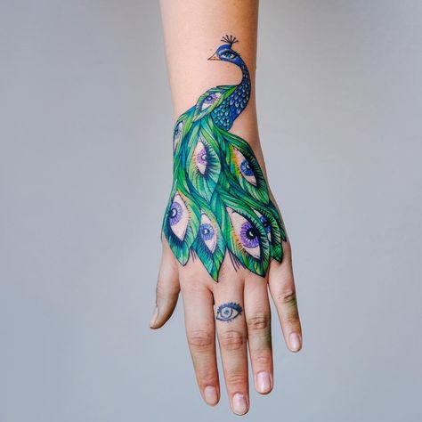 Peacoke Tattoo, Peacock Tail Tattoo, Peacock Hand Tattoo, Small Peacock Tattoo, Tattoo Designs On Hand, Peacock Tattoo Designs, Temporary Face Tattoos, Evil Eye Tattoo, Tattoo On Hand