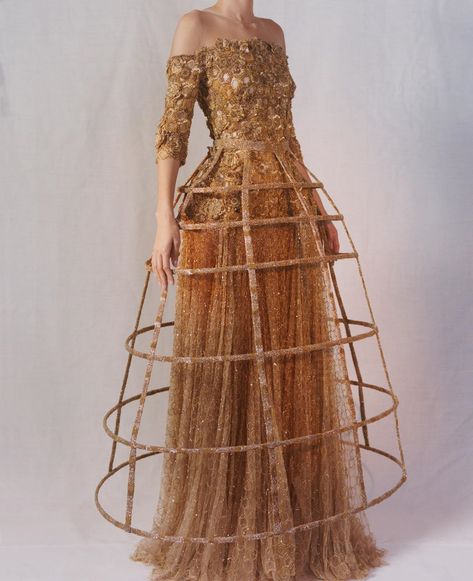 Alexander McQueen on Instagram: ““The gold dress represents the honey and the hive...it has a hip cage underneath it, all the silhouettes are emphasising the female form,…” Cage Fashion, Sculpture Fashion, Cage Skirt, Cage Dress, Skirt Inspiration, Bee Dress, Conceptual Fashion, Sarah Burton, The Hive