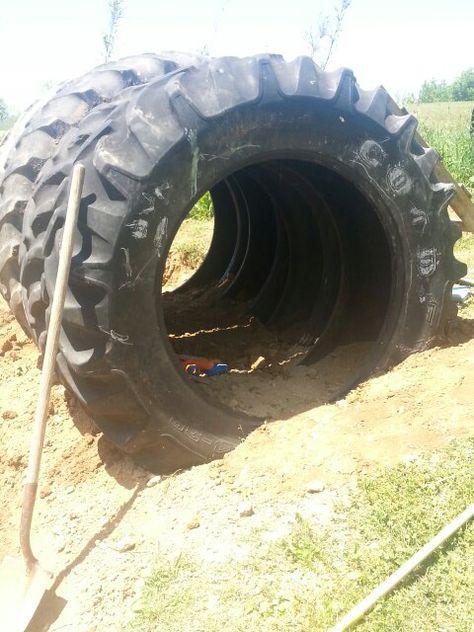 Made this for our kids. Tractor tire tunnel. Tractor Tyre Ideas Kids Outdoor Play, Tractor Tire Playground, Tractor Tire Ideas, Tyre Ideas For Kids, School Outdoor Area, Pet Goats, Diy Pretend Play, Kids Tunnel, Tire Playground