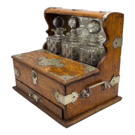 English Victorian oak tantalus case with 3 cut crystal decanters and drawer with silver plate fittings. Historical Antiques, Crystal Decanters, Victorian Antiques, Test Tubes, Cocktail Set, Crystal Decanter, Antique Boxes, Gothic Home Decor, Gothic House