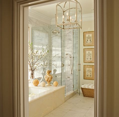 Elegant bathroom with marble clad soaking tub in front of a seamless glass shower with gray and white marble tiled surround accented with satin nickel rainfall shower head and faucet. Neutral Bathrooms Designs, Dream Bathrooms, Home Modern, Bathroom Renos, Bath Design, Beautiful Bathrooms, Chic Home, Bathroom Inspiration, Bathroom Interior Design