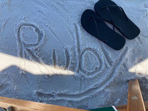 The name Ruby written in sand next to black flipflops; beach aesthetic Ruby Name Aesthetic, Aesthetic Names, Beach Aesthetic, Mens Flip Flop, Flip Flops, Ruby, Snapchat