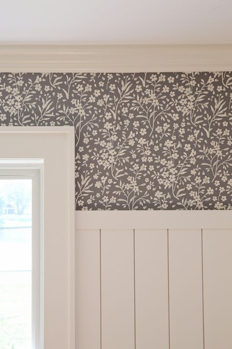 Learn how to install peel and stick wallpaper the easy way with my simple installation trick! Learn pros and cons of peel and stick wallpaper vs traditional wallpaper, the cost of peel and stick wallpaper, and how much to order too! Installing DIY peel and stick wallpaper in our dining room above vertical shiplap. Cottagecore Hallway Aesthetic, Wallpaper Above Shiplap, Board And Batten Entry With Wallpaper, Wall Paneling And Wallpaper Ideas, Board And Batten With Wallpaper Living Room, Wallpaper With Tile Bathroom, Wallpaper And Crown Molding, Shiplap And Wallpaper Accent Wall, Shiplap And Wallpaper Dining Room