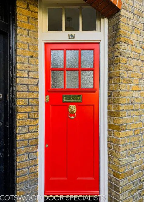 A textured glass 1920s door painted an arresting pillar box red. Divided by red-painted wooden glazing bars, the six equal panels of obscure glass are set above a simple decorative moulded shelf. This textured glass 1920s door has been fitted into a tall fanlight frame in a north London home, providing an eye-catching contrast with the yellow stock brick exterior. This classic British front door has been given the perfect finishing touch in the form of a lion’s head knocker in gleaming brass 1920s Door, Craftsman Style Front Door, Art Deco Front Door, 1930s Doors, Victorian Doors, Cottage Front Doors, Georgian Doors, Composite Front Door, Wooden Panelling