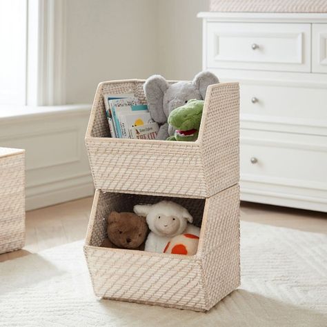 Kids can easily declutter their room by stowing toys, books and games in these stylish stacking bins. The angled, open design makes it easy to take their belongings out-and put them back in. Woven around a sturdy metal frame, the whitewashed rattan complements any decor. Slight variations in color and finish are hallmarks of time-honored weaving techniques. DETAILS THAT MATTER Handmade of hapao woven rattan over a metal frame. Edge weave features a buri binding. Features a Whitewashed finish. Bi Changing Table Storage, Stacking Bins, Toy Storage Solutions, Stackable Bins, Storage Kids Room, Kid Toy Storage, Nursery Storage, Pottery Barn Teen, Kids Storage