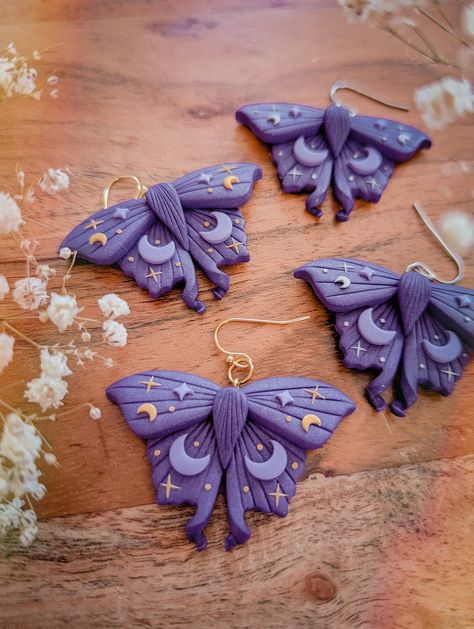 ✨Purple Mystical Moth Earrings | Dark cottagecore witch collection ✨ ⭐MATERIALS USED⭐ - Stainless Steel (tarnish resistant, more resistant than gold plated and safe for sensitive skin) - Polymer Clay (durable, flexible, waterproof and very lightweight) - Handmade Pieces, each piece is carefully shaped, painted, baked, sanded, cleaned and assembled by hands. ⭐REFUND INFORMATION⭐ - This product is not refundable - Please read all specifications before purchasing.  - Exception to refund policy at s Polymer Clay Witch Earrings, Moth Clay Earrings, Witchy Polymer Clay Ideas, Unique Polymer Clay Earrings, Purple Polymer Clay Earrings, Polymer Clay Moth, Sculpey Jewelry, Polymer Clay Witch, Cottagecore Crafts