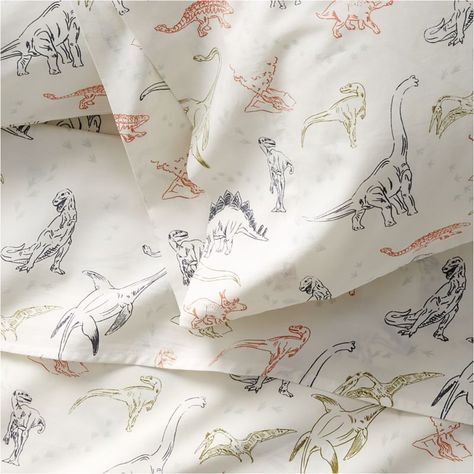 Welcome to the land before (bed)time, where roars turn to yawns and mighty creatures become sweet snuggle-o-saurs. Our Koro pillowcase is woven of cuddly organic cotton then printed with small dino illustrations, setting a cozy and colorful stage for little ones to dream of prehistoric places and friendly dino faces. (Trust us: Kids will go wild for this bedding collection.)     Multicolor dinosaur illustrations on white background  100% organic cotton  Pillowcases sold individually  Machine was Dinosaur Sheets, Dinosaur Wall Decals, Kids Sheets, Kids Pillow Cases, Quilted Baby Blanket, Dinosaur Illustration, Organic Cotton Sheets, Quilted Duvet Cover, Bed Time