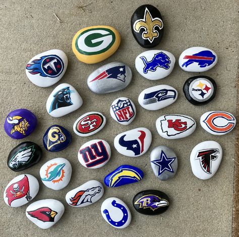 Painted Rocks NFL football Football Rock Painting, Sports Themed Painted Rocks, Football Painted Rocks Ideas, Football Rock Painting Ideas, Sports Painted Rocks, Football Painted Rocks, Football Painting Ideas, Kindness Garden, Nfl Crafts