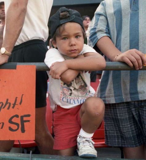 A young Brandon Crawford stands next to his father, Mike, while he holds a sign with a message for National League President Bill White on Sunday, Sept. 27, 1992, at Candlestick Park. Photo: Tom Levy / The Chronicle / ONLINE_YES Brandon Crawford, Candlestick Park, Willie Mays, Living The Dream, Sf Giants, National League, A Sign, The Dream, Baby Face