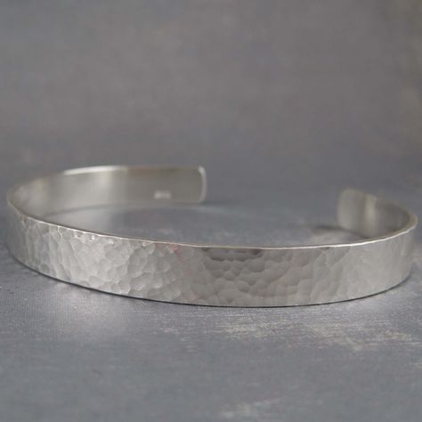 "Handcrafted from solid sterling silver, this bracelet has a fully hammered finish on the outside.  Details: - solid sterling silver  - 8mm wide (5/16th of an inch) - nice thickness of 1.5mm (just under 1/16 inch) - The price includes an inscription of up to 50 characters.  (spaces between words must be counted).  - The inscription will be made in the 2.5mm Handscript style as shown on the stamping sample.  Sizing - Womens Small fits a wrist up to 6 inches in circumference.  - Womens  Medium fit Cuff Silver Bracelet, Hammered Silver Earrings, Silver Bracelet For Men, Silver Bracelet Cuff, Feminine Jewelry, Hammered Sterling Silver, Leaf Jewelry, Bracelet Cuff, Silver Moon