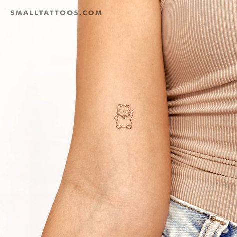 Fine line Maneki-Neko temporary tattoo done on the Tiny Japanese Tattoos, Japanese Minimal Tattoo, Fine Line Japanese Tattoo, Lucky Cat Tattoo Small, Japanese Fine Line Tattoo, Japanese Minimalist Tattoo, Japan Inspired Tattoo, Japanese Tattoo Art Small, Japan Tattoo Small