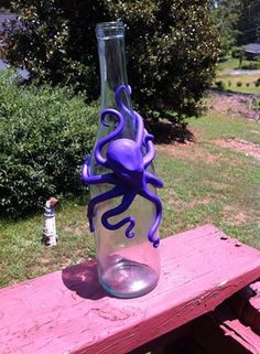 I decorate wine bottles with polymer clay by hand. Each is one of a kind and can… Clay Bong, Decorate Wine Bottles, Polymer Clay Wine Glasses, Octopus Bottle, Polymer Clay Octopus, Clay Octopus, Sculpting Inspiration, Ringed Octopus, Polymer Clay Ideas