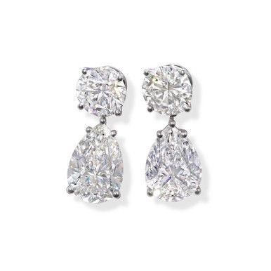 A pair of drop earrings featuring 10.01 carats of pear shaped diamonds and 4.80 carats of round brilliant diamonds, set in 18 karat white gold. Pear Diamond Earrings, Expensive Earrings, White Diamond Jewelry, Diamonds Direct, Big Diamond, Diamond Dangle Earrings, Diamond Bar, Expensive Jewelry, Diamond Drop Earrings