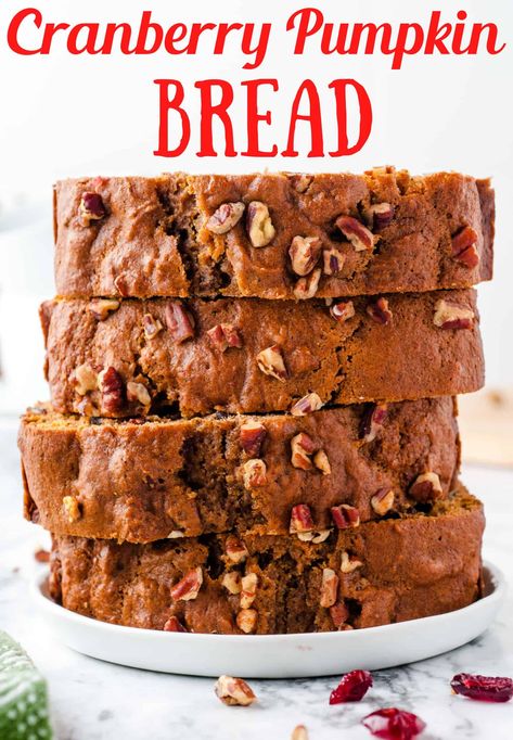 This Cranberry Pumpkin Bread is simple to make and has all the flavors of fall! It is a combination of pumpkin, dried cranberries and pecans with nutmeg, ginger and cinnamon. Enjoy the aroma of pumpkin baking on a chilly day with this easy pumpkin bread recipe! Craisin Pumpkin Bread, Pumpkin Cranberry Nut Bread, Pumpkin And Cranberry Recipes, Pumpkin Cranberry Loaf, Cranberry Pumpkin Bread Recipe, Cranberry Pumpkin Bread, Pecan Bread Recipe, Pumpkin Pecan Bread, Christmas Breads