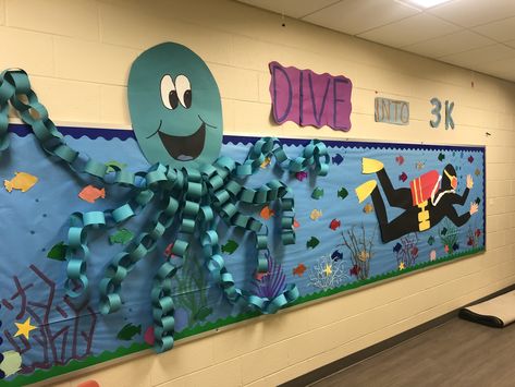 Ocean Theme School Hallway, Dive Into A Good Book Bulletin Board, Beach Theme Hallway, Dive Into Learning Bulletin Board, Dive Into Learning Theme, Ocean Themed Bulletin Boards, Ocean Theme Classroom Door, Under The Sea Bulletin Board Ideas, Octopus Bulletin Board