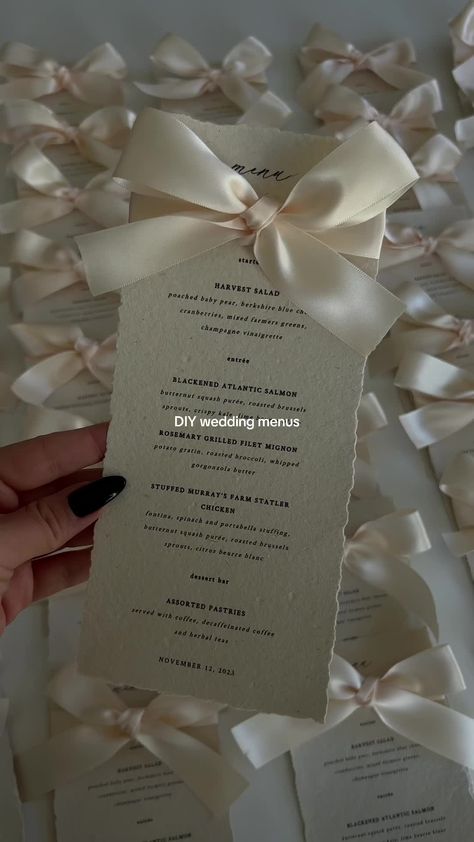 love how these wedding menu cards came out 🤍 #weddingmenu #weddingmenucards #weddingdecor #diyweddingdecor #decklededgepaper #weddingmenuinspo november 2023 bride DIY wedding menu wedding menu cards deckle edge wedding menu wedding menu budget friendly wedding menu bow wedding menu ideas hosting menu cards wedding checklist amazon wedding decor destination wedding Diy Wedding Menu Ideas, Wedding Menu Ribbon, Wedding Menu With Bow, Wedding Table Menu Cards, Wedding Reception Dinner Ideas, Menu Wedding Ideas, Wedding Menu Ideas Food, Food Menu Wedding, Amazon Wedding Decor