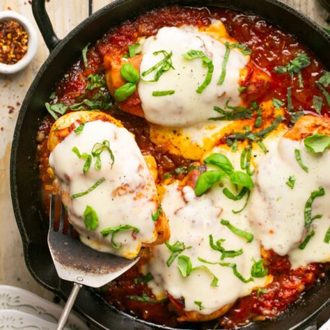 30-Minute Mozzarella Chicken Skillet Cheesy Mozzarella chicken is an insanely delicious high protein low-carb and keto friendly (just 4g net carbs!) weeknight dinner recipe! It’s pan seared chicken nestled in tomato sauce and topped with melty mozzarella, then baked to perfection. Ready in about 30 minutes! Prep Time 5 minutes mins Cook Time 25 minutes mins Total Time 30 minutes mins Course: Main CourseCuisine: American, ItalianKeyword: healthy, low-carb, mozzarella chicken Servings: 4 ... Healthy Chicken Parmesan, Chicken Skillet, Yummy Chicken, Mozzarella Chicken, Fried Chicken Breast, Delicious Burgers, Yummy Chicken Recipes, Weeknight Dinner Recipe, High Protein Low Carb