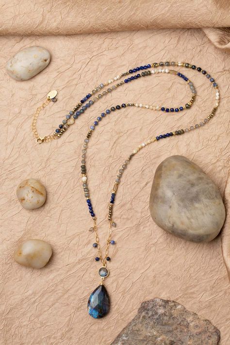 Discover the vibrant and stunning colors of the Blue Moon Collection in this eclectic necklace! Gold Filled (Lead & Nickel Free) Lapis Lazuli, Pyrite, Sodalite, Labradorite, Mother Of Pearl, Abalone 30.5-32.5" adjustable length, with gold filled lobster claw clasp We hand select our natural materials, thus there may be slight variations in color and/or size that will not detract from the overall aesthetic. Our unique handcrafted designer jewelry for women is made in America, each design created Lapis Beaded Necklace, Eclectic Necklace, Floyd Va, Patina Jewelry, The Blue Moon, Silver Gold Earrings, Silver Gold Necklace, Pyrite Necklace, Bead Inspiration