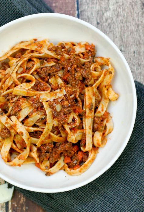 Weeknight Bolognese with Fettuccine Weeknight Bolognese, Fettuccine Recipes, Marzano Tomatoes, Meal Rotation, Fettuccine Noodles, Pasta Bolognese, Fettuccine Pasta, Dried Basil, Button Mushrooms