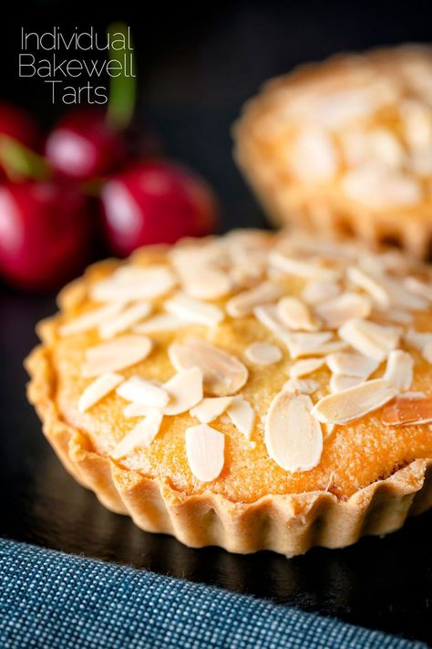 Mini Bakewell tarts, a scaled-down version of a true British favourite featuring a sweet crust pastry filled with cherry jam and frangipane. This recipe makes 4 perfect individual tartlets and they will last, if stored properly, for 3-4 days. Individual Bakewell Tarts, Mini Bakewell Tart Recipe, Pastry Tarts Desserts, Mini Bakewell Tart, Cherry Bakewell Tart Recipe, Mini Frangipane Tarts, Small Fruit Tarts, Mini Tarts Recipe Dessert, Tart Fillings Ideas