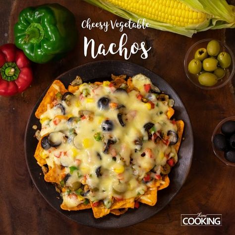 HomeCookingShow on Instagram: "Cheesy Vegetable Nachos | Veg Nachos | Snacks #CheesyVegetableNachos #VegNachos #snacks #homecooking #cheesynachos #nachos #tortillachips #starterrecipes #restaurantstylenachos #cafestylenachos #homemadenachosrecipe #streetfood #nachosrecipevegetarian Ingredients Nachos Mozzarella Cheese - 200 Gms (Buy: https://amzn.to/2OdsBBQ) Chopped Green Capsicum Chopped Red Capsicum Cooked Sweet Corn - 1 Cup Black Olives (Buy: https://amzn.to/2vmWFV4) Green Olives Itali Veg Nachos, Vegetable Nachos, Cooking Sweet Corn, Cheesy Vegetable, Nachos Ingredients, Cheesy Nachos, Homemade Nachos, Green Capsicum, Nacho Chips