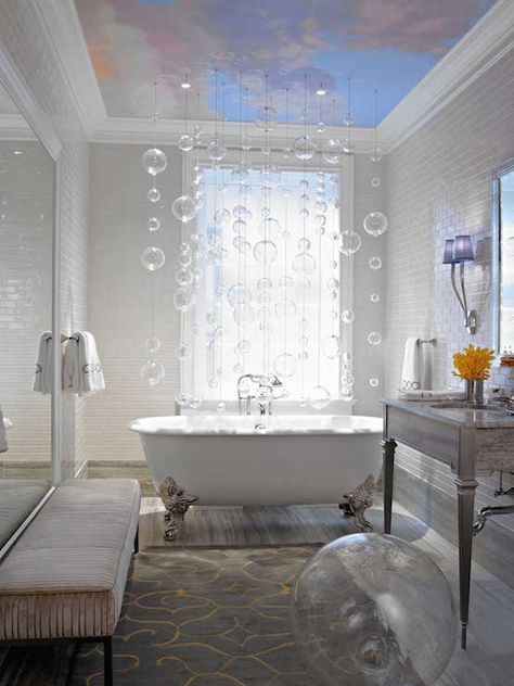 Eclectic bathroom features a sky mural on ceiling accented with a cluster of bubbles light pendants raining over a silver claw foot tug placed in front of a window. White Clawfoot Tub, Bathroom Clawfoot Tub, Bathroom With Clawfoot Tub, Clawfoot Tub Bathroom, Long Couch, Silver Bathroom, Eclectic Bathroom, Bad Inspiration, Bubble Chandelier