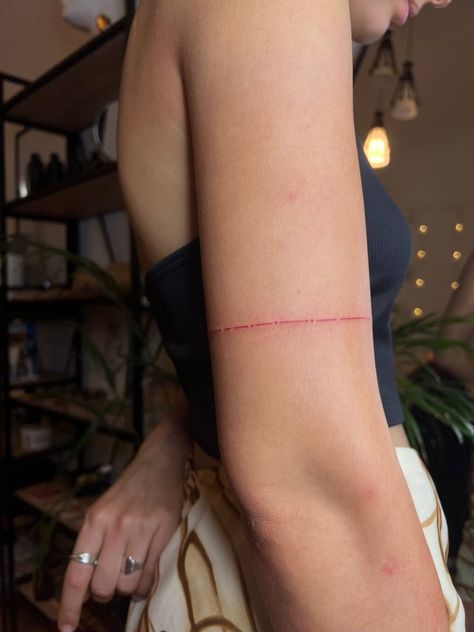 #tattoo #tattooideas #tattoodesign #aesthetic #tattoofineline Red Line Wrist Tattoo, Red Arm Band Tattoo For Women, Fineline Red Tattoo, Red Tattoo Fine Line, Healed Red Tattoo, Red Bracelet Tattoo, Red String Theory Tattoo, Small Red Tattoos For Women, Take Care Tattoo