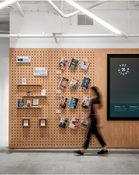 Peg Board Display Wall, Pegboard Visual Merchandising, Wood Display Wall, Interactive Walls Office, Product Design Studio, Pegboard Retail Display, Book Store Design Interior, Magnet Wall Ideas, Interactive Office Wall