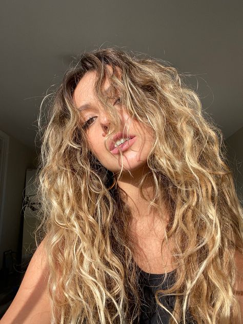 Dark Curly Blonde Hair, Beach Hair Color Blonde, Long Wavy Blonde Hair Beachy Waves, Wavy Honey Blonde Hair, Blonde Beachy Highlights, Curly Beachy Hair, Dark Blonde Hair With Highlights Curly, Wavy Curly Blonde Hair, Beach Hair Curly