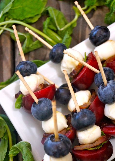 Mini Fruit Skewers Recipe can be made ahead and are the perfect 4th of July appetizer! Fresh, festive and fun, they are over-the-top delicious and great for any outdoor barbecue or summer party. #redwhiteandblue #july4th #skewers #kebabs #bacon #blueberries #cherries #mozzarella #appetizers Purple Party Foods, 4th Of July Food Ideas, July Food Ideas, 4th July Food, 4th Of July Food, 4th Of July Recipes, Weekend Recipes, Fruit Kebabs, Kebab Recipe