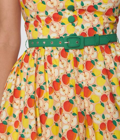 This adorable 1950s style swing dress is crafted in a smooth woven fabric that dances with charming red apples throughout the yellow backdrop. The self tie halter is framed by the sleeveless silhouette, while the full swing skirt is cinched by a red belt. Crinoline added for volume, sold separately. Available in sizes XS-5X while supplies last. Vintage Colour Palette 1950s, Vintage Color Palette 1950s, 50 Fashion Vintage 1950s, Educator Aesthetic, Yellow And Red Outfit, Kooky Fashion, Red And Yellow Outfit, Apple Outfits, Apple Outfit