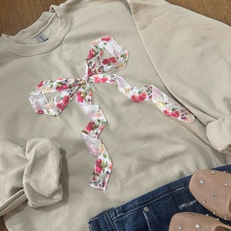 This cute design makes the perfect gift for the bow lover in you life. The beautiful floral bow ribbon is sewn on. Go up in size for a more oversized look. All sales are final due to customization of product. Will ship USPS or UPS unless requested otherwise. Colors and exact shape of bow may differ slightly from appearance on screen. Bow Sweatshirt, Trendy Bows, Hoodie Diy, Patchwork Sweatshirt, Patchwork Clothes, Cute Ribbon, Sewing To Sell, Sweatshirt Trendy, Diy Sweatshirt