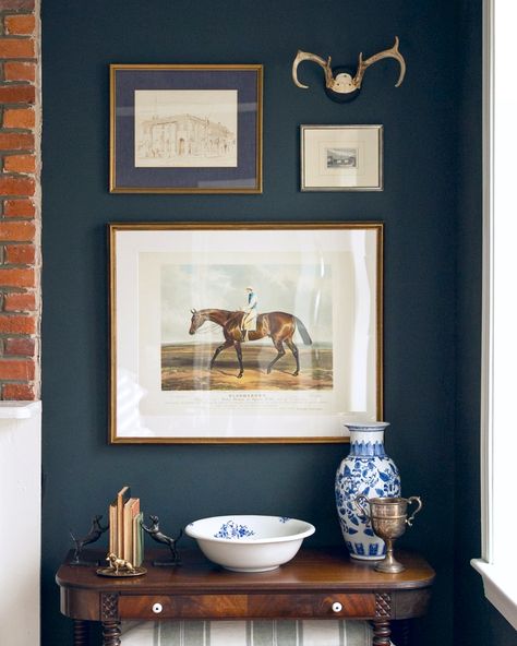 Our house is a constant work in progress, but I think I’m finally done tinkering with this corner of our bedroom! I searched for months to find the right horse print with touches of blue for this space, and discovered "Bloomsbury" by Charles Hancock – the perfect nod to my favorite #plainbay Thoroughbred. 🐎 Fox Hunting Decor Equestrian Style, Coastal Equestrian Decor, Traditional Western Home Decor, Equestrian Room Ideas Bedrooms, Equestrian Bedroom Ideas, Equestrian Artwork, Equestrian Chic Decor, Equestrian Interior, Equestrian Bedroom