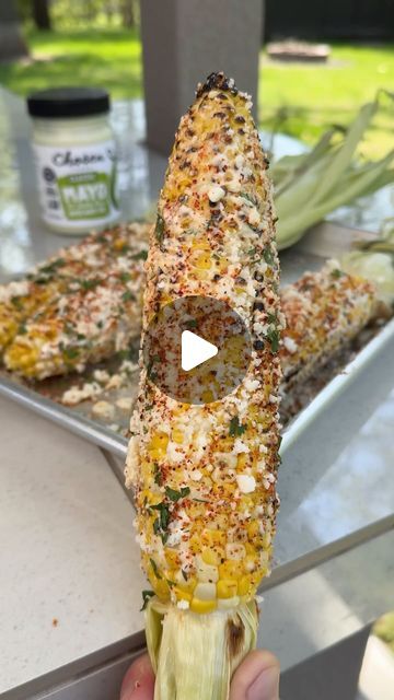 Nick Nesgoda on Instagram: "Grilled Elote Corn with @chosenfoods    This is packed with a ton of flavor and will be the best thing you eat all summer!   Recipe • Soak the ears of corn in water for 10-15 minutes  • Grill the corn at 350°F for 15 minutes indirectly from the heat  • Remove the corn then carefully peel back the husk and discard of the corn silk  • Secure the husk together by wrapping it with 1 husk then tie a knot. This will give you a handle to eat the corn from.  • Mix together ½ cup of Chosen Foods Avocado Oil Mayo, ½ cup of mexican crema and juice from ½ lime.  • Drizzle Chosen Food’s 100% pure avocado oil on all sides of the corn, then grill the corn over direct heat. Remove once you have char on all sides of the corn.  • While the corn cools down, coat it in the cream mi Fire Grilled Corn On The Cob, Corn On The Cob Bar Ideas, Corn On The Grill In Foil, Corn On The Grill In Husk, Corn Recipes Mexican, Elote Corn Recipe, Grilled Elote, Corn On The Cob Recipes, Corn Elote Recipe