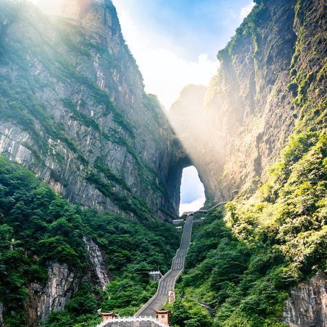 The numbers 9, 99, and 999 hold special significance in Zhangjiajie, China, where visitors can climb to the world’s highest naturally formed arch, the Gateway to Heaven. Heavens Gate China, Tianmen Mountain, Mountain Formation, Stone Park, Dangerous Roads, Zhangjiajie, Heaven's Gate, Magical Images, Stairway To Heaven