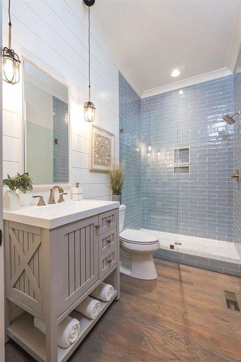 Coastal Farmhouse bathroom with shiplap walls, store-bought vanity and hardwood flooring and blue subway tile Neutral coastal Farmhouse bathroom Farmhouse bathroom ideas #coastalFarmhousebathroom #coastalbathoom #Farmhousebathroom #bathroom #BathroomRemodelIdeas #basementideas Coastal Farmhouse Bathroom, Makeover Kamar Mandi, Beautiful Bathtubs, Bad Inspiration, Interior Minimalista, Blue Tile, Shower Remodel, Bathtubs, Bathroom Remodel Master