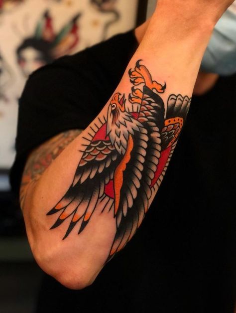 100 Best Traditional Tattoos Of All Time - TheTatt Eagle Tattoo Sleeve, Eagle Forearm Tattoo, Best Traditional Tattoos, Eagle Tattoo Forearm, Eagle Tattoo Arm, Traditional Tattoo Arm, Traditional Tattoo Man, Traditional Eagle, Traditional Eagle Tattoo