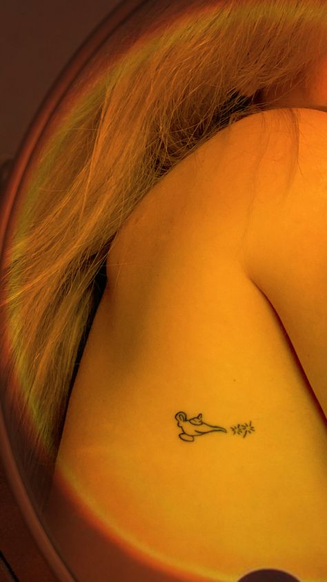 Minimalistic woman tattoo fine line tattoos Disney Aladdin’s lamp genie Princess Inspired Tattoo, Jasmine Tattoo Disney, Disney Tattoos Small Princess, Aladdin Inspired Tattoos, Disney Aladdin Tattoos, Genie Tattoo Disney, Princess Jasmine Tattoo Ideas, Jasmine Tattoo Princess, Aladin Tattoo Ideas