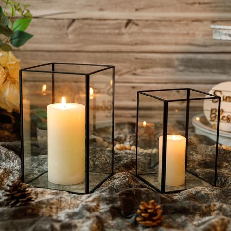 PRICES MAY VARY. 💖【ELEGANT DESIGN TO FALL IN LOVE WITH】Combining crystal clear yet sturdy glass with black metal frames with clean lines, these hurricane candle holders are simple and stylish. Perfect for a variety of home decor styles from modern, farmhouse, bohemian, and more. 💖【PERFECT SIZE & HIGHLY VERSATILE】Glass candle holder set includes 2 different sizes of hurricane glass candle holders (CANDLES NOT INCLUDED). LARGE SIZE: 9 x 5.5 x 5.5 inches, SMALL SIZE: 7.2 x 4.8 x 4.8 inches. You c Floating Candle Wedding Decor, Candles For Wedding, Black Candle Holder, Pillar Candles Wedding, Western Candles, Clear Candle Holders, Black Pillar Candles, Dinner Centerpieces, Black Candle Holders