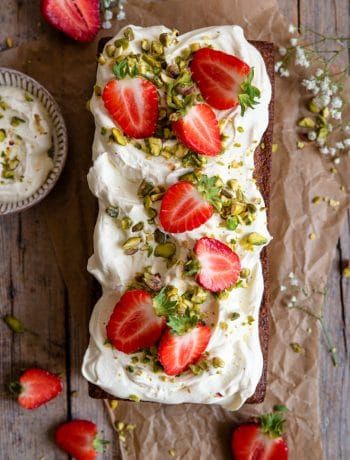 An overhead shot of a pistachio cake on a rustic wooden surface Strawberry Pistachio, Cake With Strawberries, Pistachio Cake, Chocolate Cream Cheese, Strawberry Cakes, Piece Of Cake, Savoury Cake, Food Processor, Strawberries And Cream