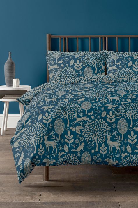 Update your bedroom for the festive season with a contemporary take on a fairy-tale forest, with its stunning deep blue base and silver motifs and a ditsy leaf reverse. Also available in blush pink and white. Produced using our easy-care polycotton blend for easy laundering. Machine washable. 52% Polyester,48% Cotton Blue Cottagecore Bedroom, Sage And Blue Bedroom, Copenhagen Home, Floral Print Bedding, Blue Linen Bedding, Fairy Tale Forest, Bed Sets, Blue Bedding, Blue Bedroom