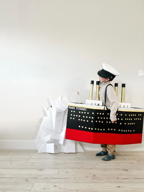 My son asked to be the titanic for halloween. I bought sheets of corregated plastic board and some cardstock from michaels. I used duct tape for the colours from dollarama. The frame is built arlind a diaper box. Titanic Costume, Plastic Board, The Titanic, The Frame, Duct Tape, Titanic, My Son, Card Stock, Halloween