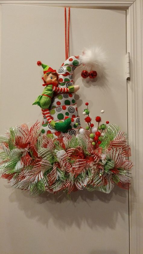 I made this mesh elf santa hat. Santa Wreath Diy, Fun Wreaths, Christmas Witch, Elf Hats, Elf Shelf, Christmas Door Decorating Contest, Hat Wreath, Easter Wood Crafts, Deco Mesh Wreaths Diy