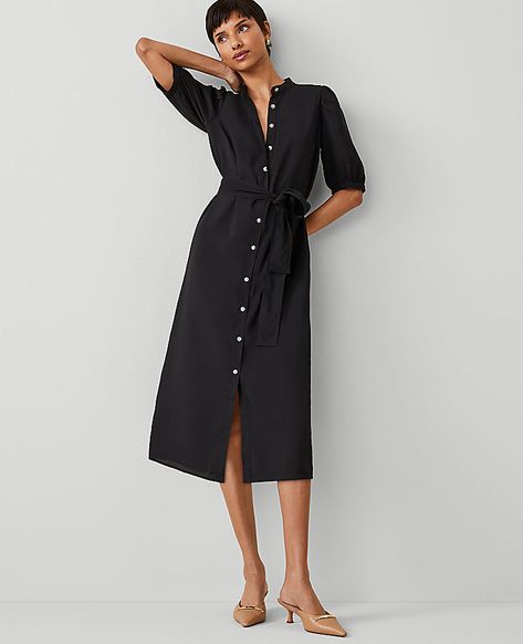 A stand collar adds a refined air to our puff sleeve midi shirtdress, cinched with a flattering tie waist. Stand collar. Short sleeves with shirred sleeve caps. Button front placket. Self tie belt. Lined body.,Hit:Hits at mid-calf,Imported:Imported,Length:30" from natural waist,Fabrication:100% Polyester,Garment Care:Machine Washable Stand Collar Belted Midi Shirtdress by Ann Taylor Size regular - 18 Black Women's Shirtdress, Regular, Split, Neck, Short, Sleeve, Dresses, 100%, Polyester, Machine Casual Winter Dresses For Women Over 50, Ann Taylor Outfits, Shirred Sleeve, Travel Dresses, Office Fits, Fall Style Guide, Midi Dress Fall, Plaid And Leopard, Short Sleeve Midi Dress