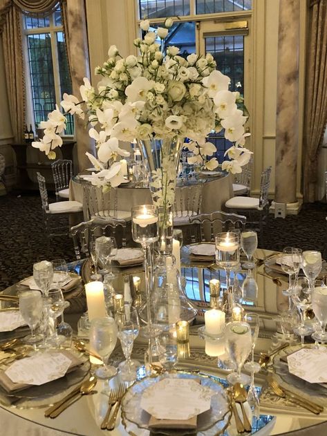 Custom mirror table tops housing beautiful textured arrangement with phalaenopsis orchids Mirror Table Top Wedding Decor, Mirror Table Top Wedding, Mirror Table Top, Orchid Centerpieces Wedding, Custom Mirror, Orchid Centerpieces, Centerpieces Wedding, Custom Mirrors, Phalaenopsis Orchid